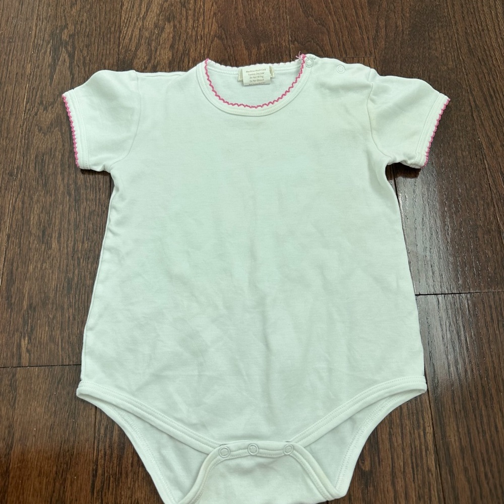 Charming White Bodysuit with Pink Trim